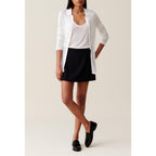 Shorts con falda cruzada y botones
