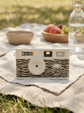 TimeLens® Cream Zebra Camera