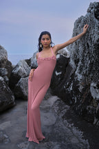 Knit dress with crocheted flowers – Pink, by the Parisian brand Phème Paris, designed in Paris, featuring hand-crocheted flowers, photographed on the coast of the South of France, flowing silhouette ideal for holidays and summer ceremonies.