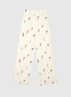 An'ge – Raiponce Trousers Ecru, ecru wide-leg trousers with red and green floral print, front view