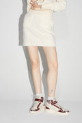 La minifalda blanca Preppy de Blake