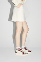La minifalda blanca Preppy de Blake