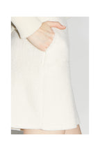 La minifalda blanca Preppy de Blake