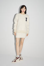 La minifalda blanca Preppy de Blake