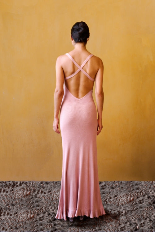 Knit dress with crocheted flowers – Pink, by the Parisian brand Phème Paris, designed in Paris, featuring hand-crocheted flowers, photographed on the coast of the South of France, flowing silhouette ideal for holidays and summer ceremonies.