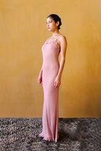 Knit dress with crocheted flowers – Pink, by the Parisian brand Phème Paris, designed in Paris, featuring hand-crocheted flowers, photographed on the coast of the South of France, flowing silhouette ideal for holidays and summer ceremonies.