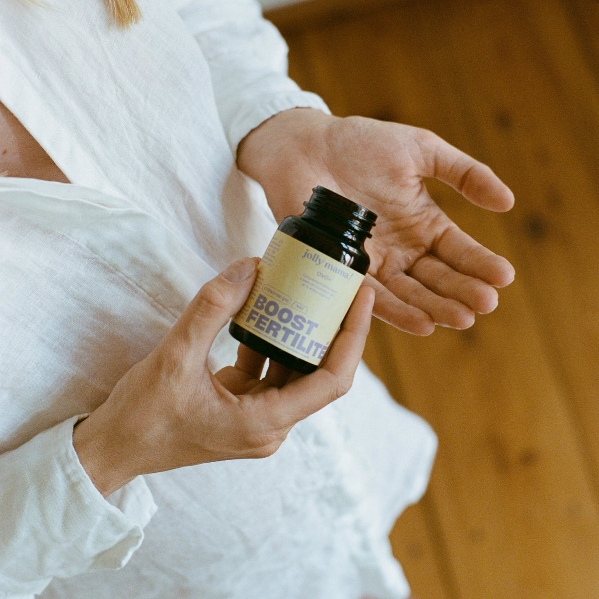 photo of woman with fertility capsules
