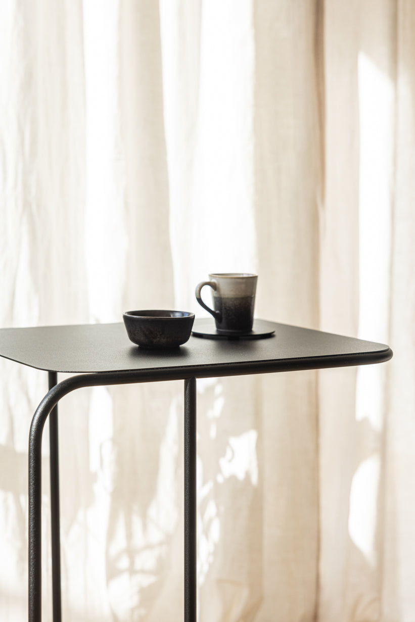 Beautiful DENYA with one cup and one plate on the table, minimalist design