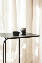 Beautiful DENYA with one cup and one plate on the table, minimalist design