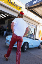 BRUNE red vinyl trousers