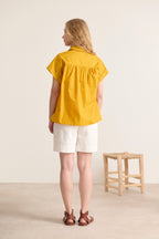 Short mustard yellow cotton shirt, sleeves covering the shoulder and classic collar, ideal for summer, ready-to-wear for women 
