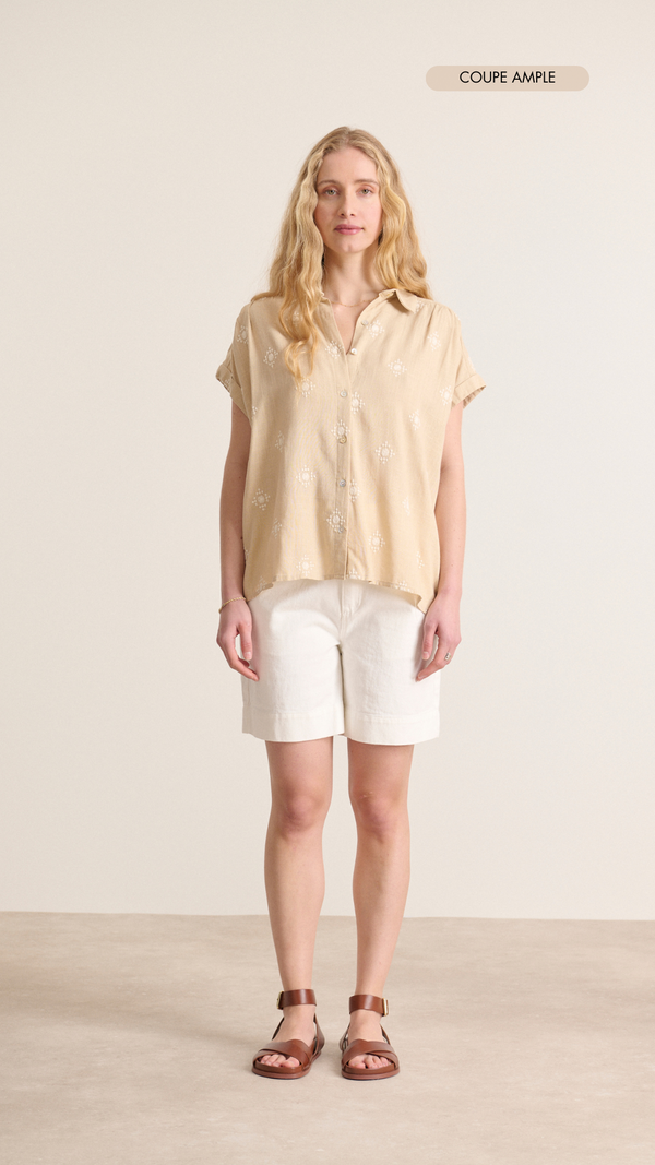 Beige shirt with very short sleeves with white embroidery details and cutouts and gathers for a feminine look Garance Paris