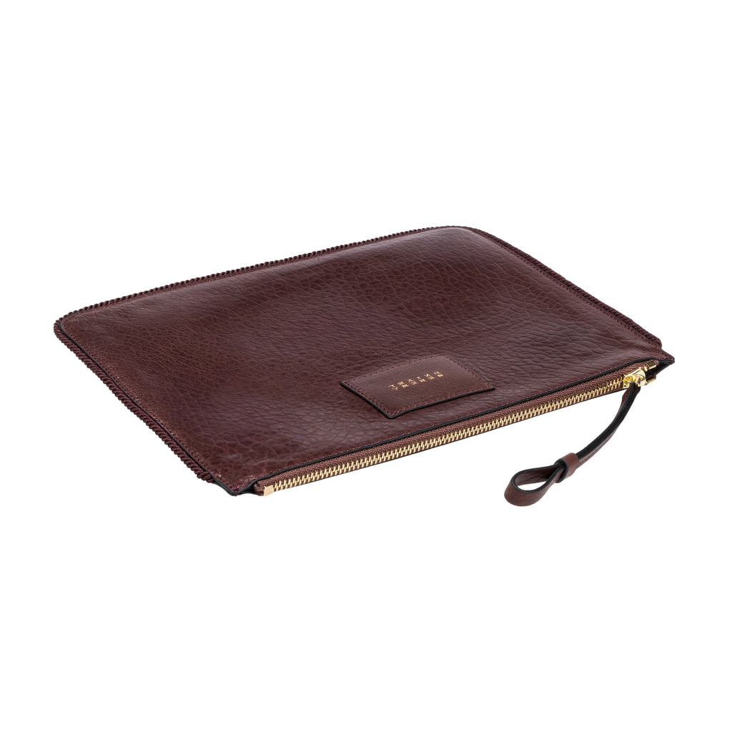 Burgundy leather in a shade of dark cherry inner bag  with gold zipper on a white background
