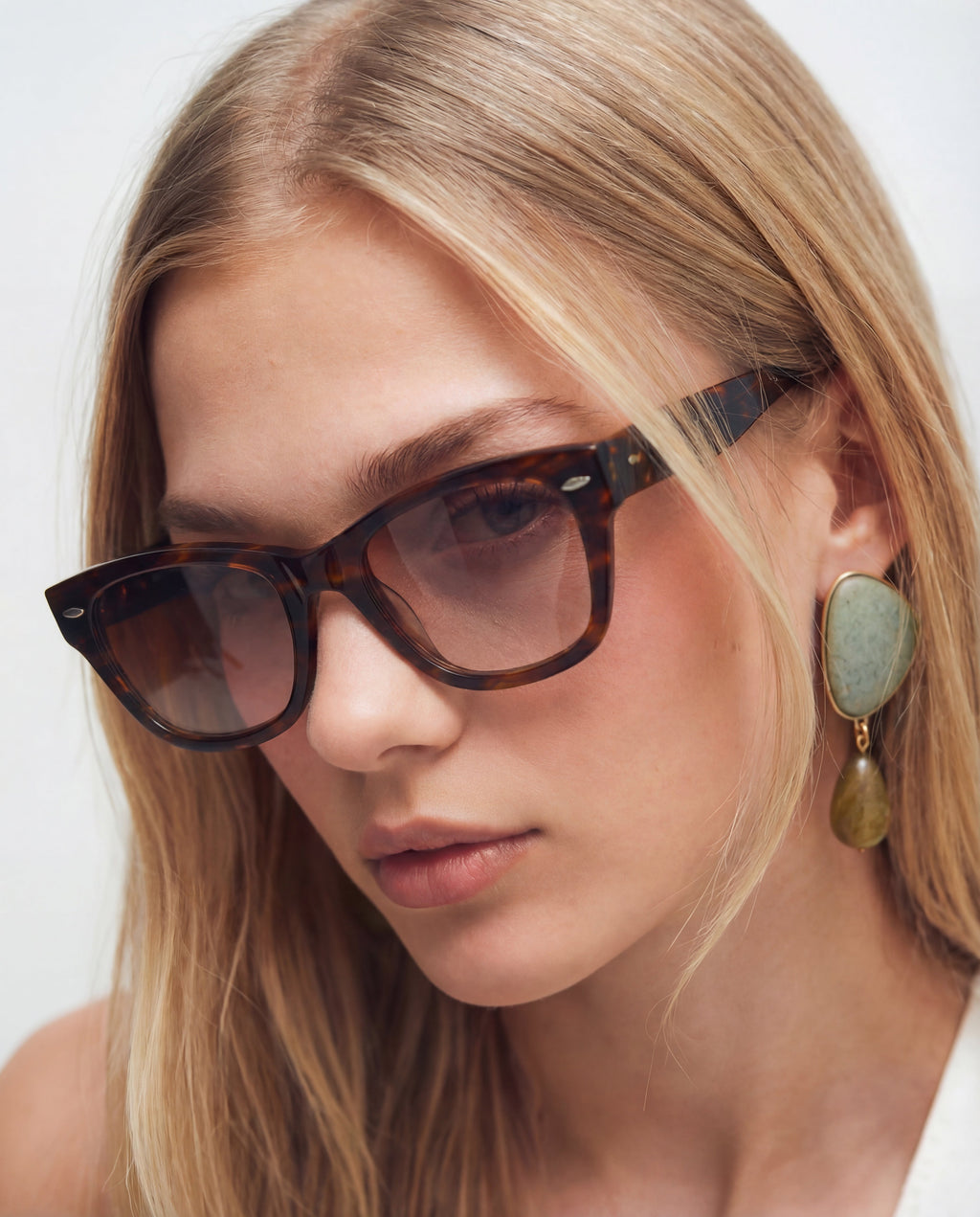 Erin Brown sunglasses — rectangular frame, worn by a woman