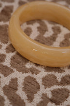 Round ecru resin bangle