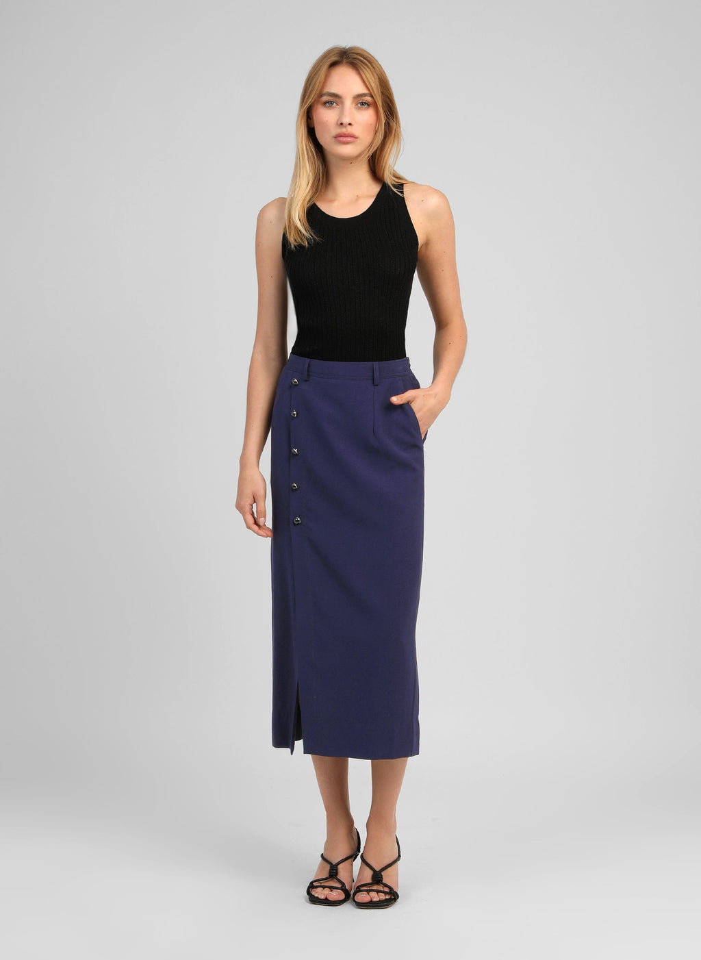 An'ge – Gaella Navy Midi Skirt, navy blue maxi skirt worn by a model, front view