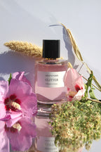 Perfume con purpurina