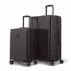 Duo of GYL Intemporelle rigid suitcases in black with ribbed shells and telescopic handles. #couleur_noir