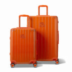 Two GYL Intemporelle orange hard-shell suitcases, 2 sizes, with extended trolley handle. #couleur_orange foncé