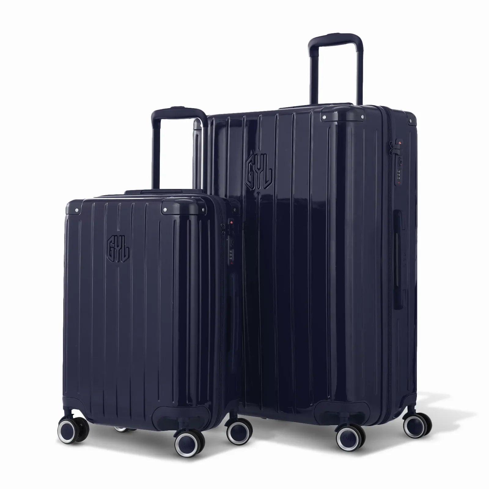 Duo of GYL Intemporelle navy hard-shell suitcases with ribbed shells and telescopic handles. #couleur_marine