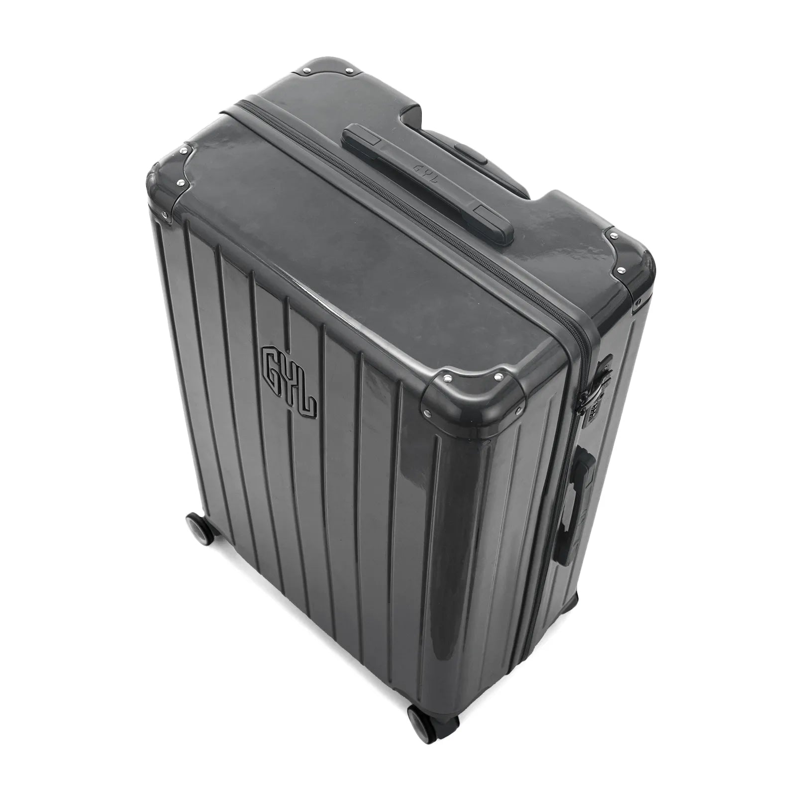 Angled view of the GYL Intemporelle dark grey hard-shell suitcase with reinforced corners and glossy ribbed shell. #couleur_gris foncé