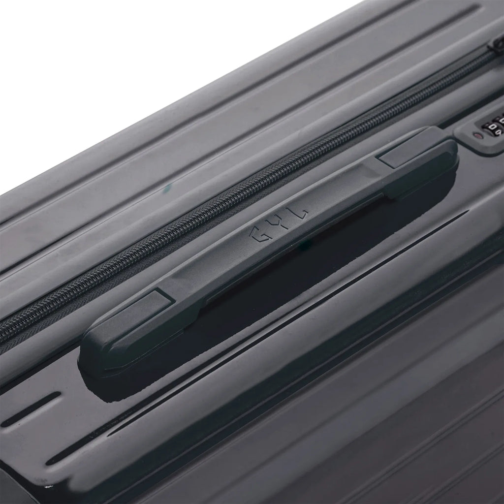 Rigid top handle of the GYL Intemporelle dark grey suitcase with embossed logo on top. #couleur_gris foncé