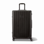 Front view of the GYL Intemporelle black hard-shell suitcase, embossed logo and 360-degree wheels. #couleur_noir