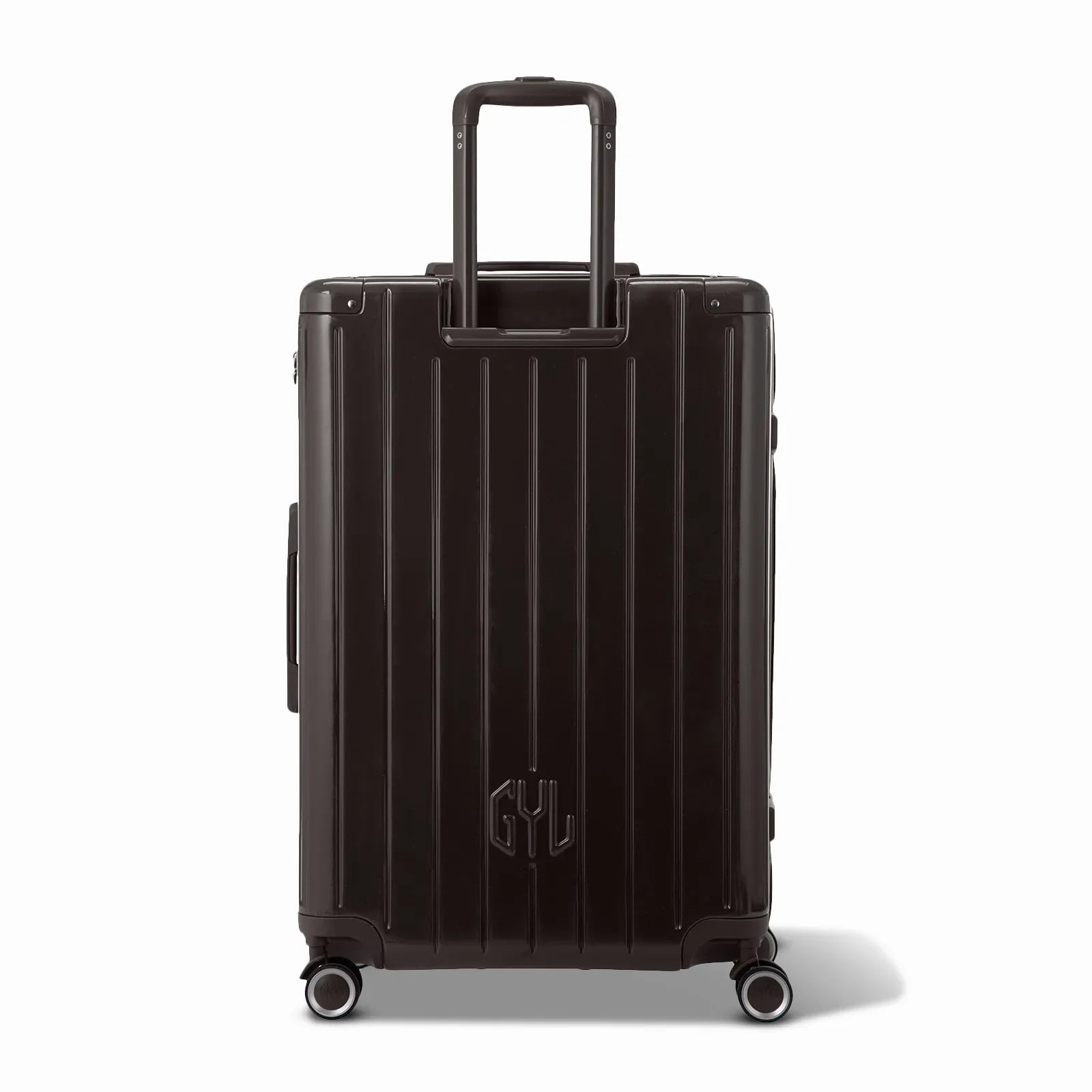 Rear view of the GYL Intemporelle black hard-shell suitcase with integrated handles and spinner wheels. #couleur_noir