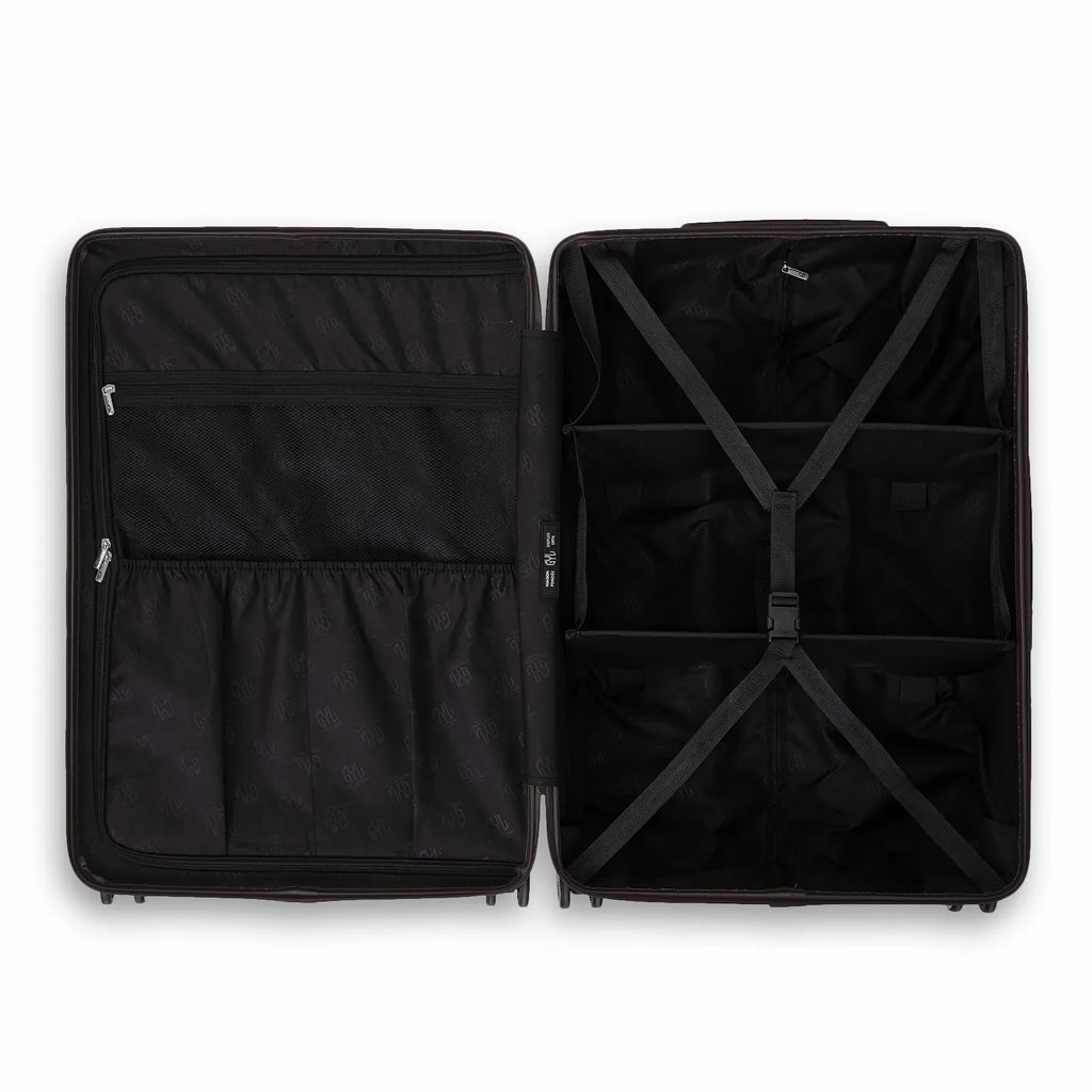Compartmentalised interior of the GYL Intemporelle black suitcase with cross straps and mesh pockets. #couleur_noir