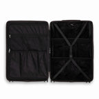 Compartmentalised interior of the GYL Intemporelle black suitcase with cross straps and mesh pockets. #couleur_noir