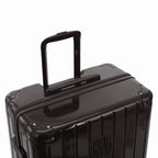 GYL telescopic trolley handle extended on the Intemporelle black polycarbonate suitcase. #couleur_noir
