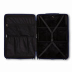 Compartmentalised interior of the GYL Intemporelle navy suitcase with cross straps and mesh pockets. #couleur_marine