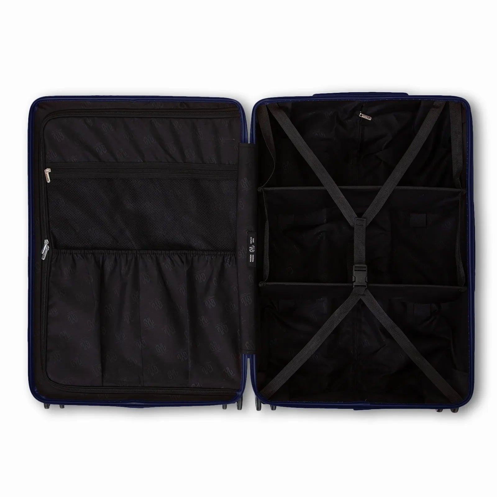 Compartmentalised interior of the GYL Intemporelle navy suitcase with cross straps and mesh pockets. #couleur_marine