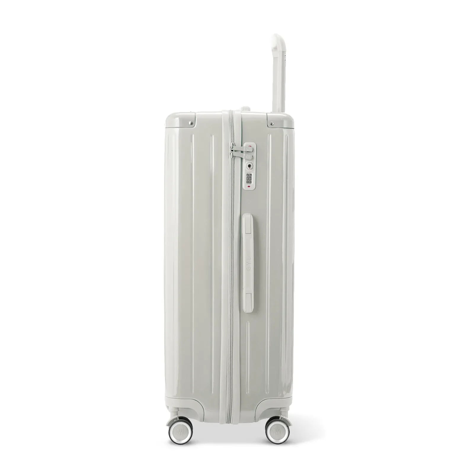 Side view of the GYL Intemporelle sand hard-shell suitcase with telescopic handle and TSA lock. #couleur_sable
