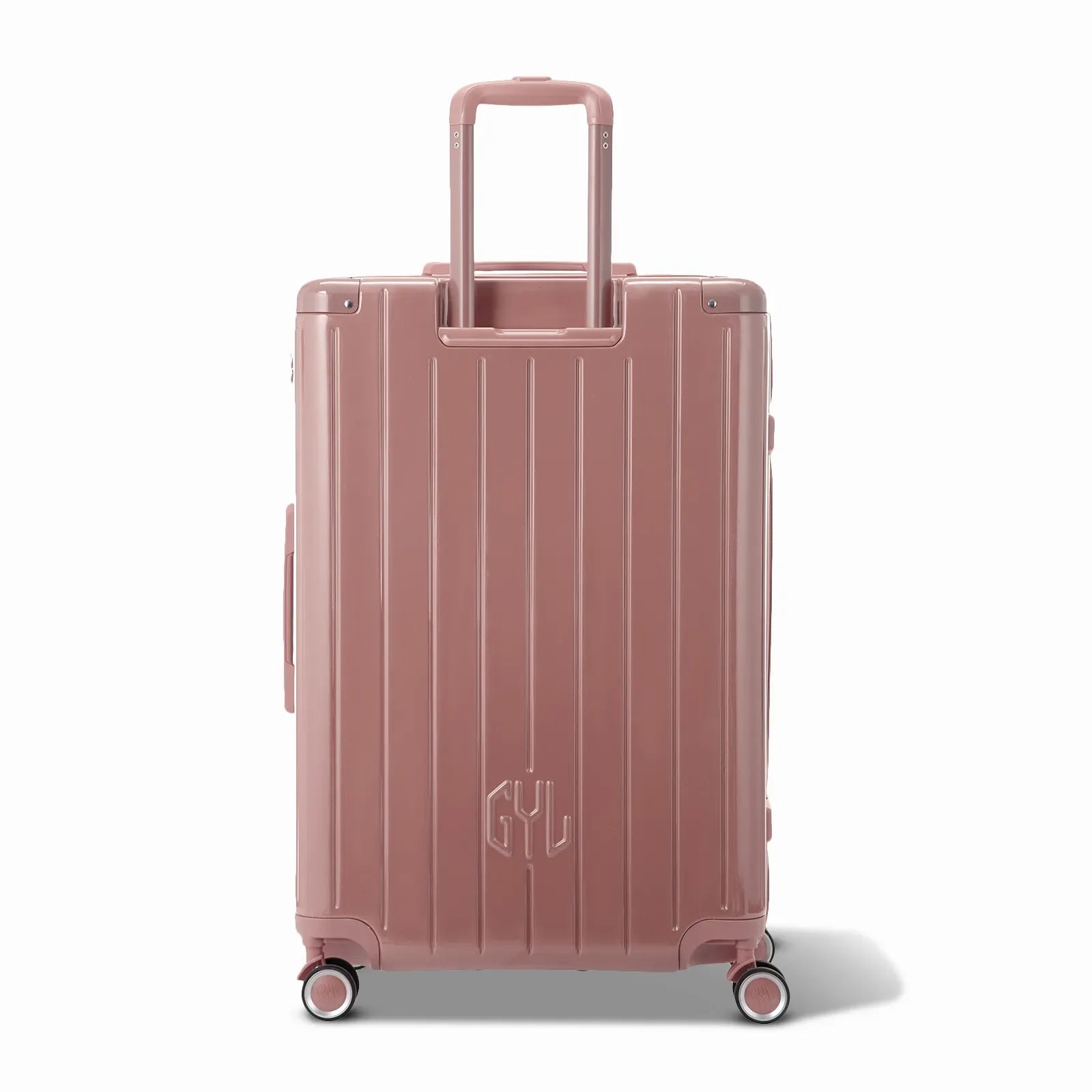 Rear view of the GYL Intemporelle rose gold hard-shell suitcase with integrated handles and swivel wheels. #couleur_rose gold