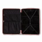 Compartmentalised interior of the GYL Intemporelle rose gold suitcase with cross straps and mesh pockets. #couleur_rose gold