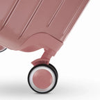 360° double wheel of the GYL Intemporelle rose gold suitcase with GYL logo engraved on the hub. #couleur_rose gold
