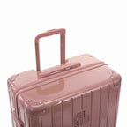 Extended GYL telescopic trolley handle on the Intemporelle rose gold polycarbonate suitcase. #couleur_rose gold