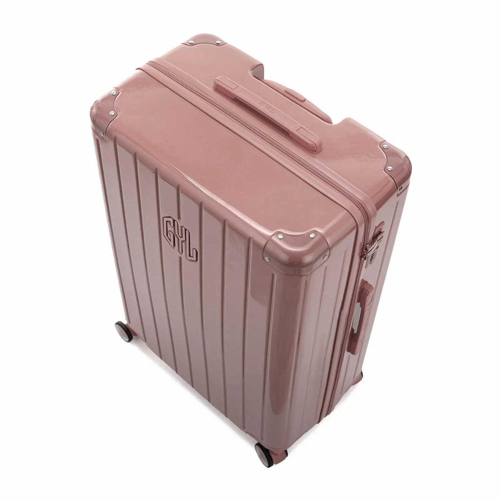Angled view of the GYL Intemporelle rose gold hard-shell suitcase with reinforced corners and glossy ribbed shell. #couleur_rose gold