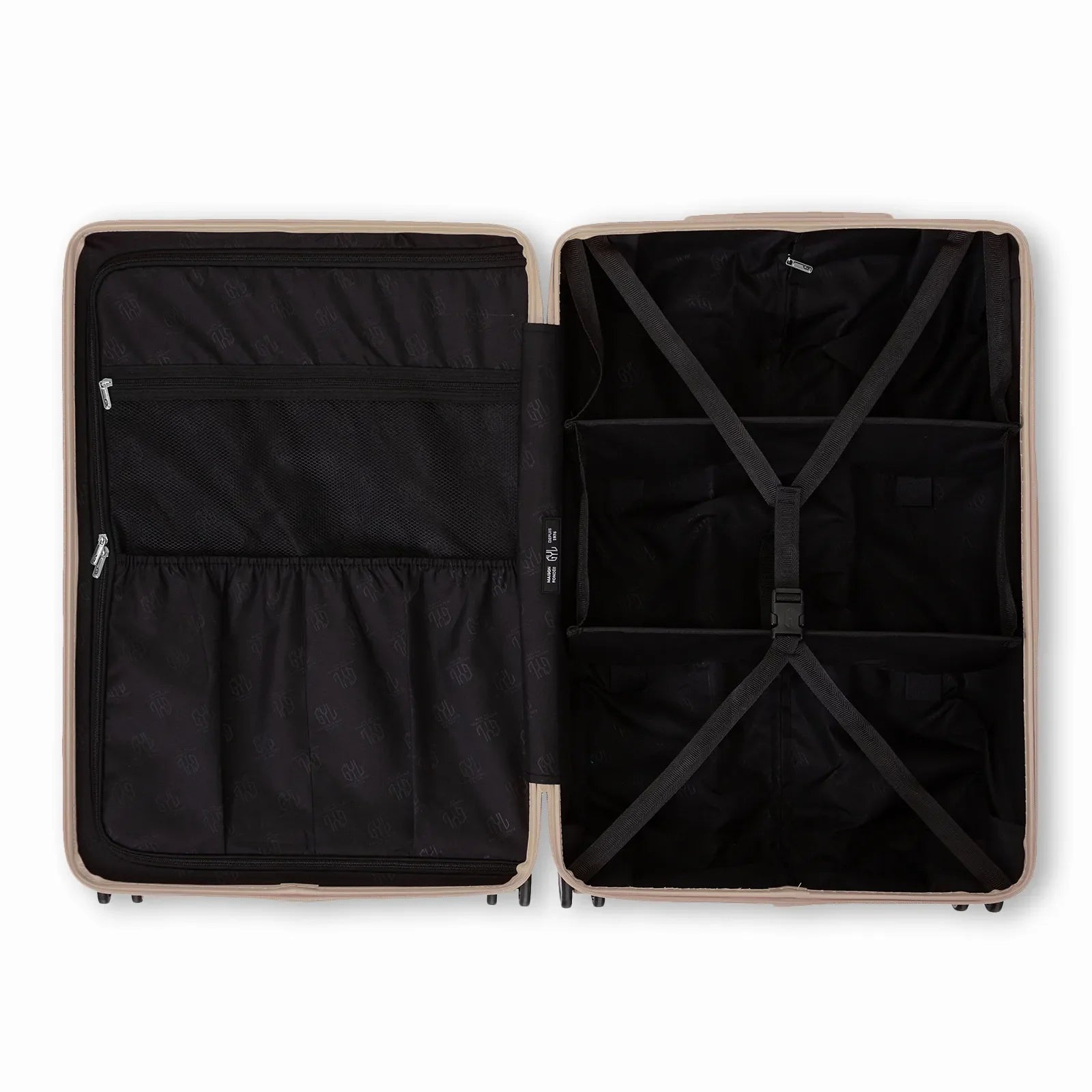 Compartmentalised interior of the GYL Intemporelle sand suitcase with cross straps and mesh pockets. #couleur_sable