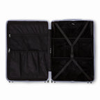 Compartmentalised interior of the GYL Intemporelle silver suitcase with cross straps and mesh pockets. #couleur_argent
