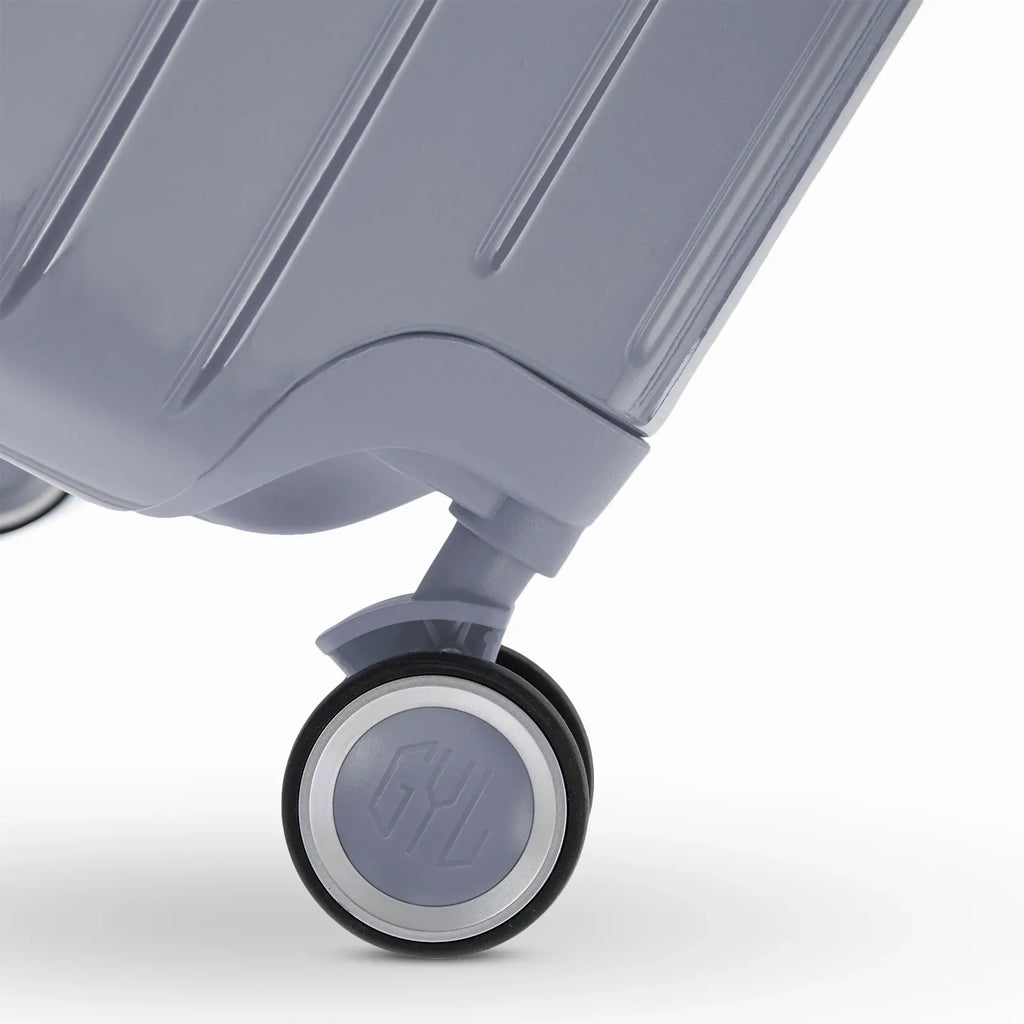 Rueda doble 360° de la maleta GYL Intemporelle plateada con grabado del logo GYL en el cubo. #couleur_argent