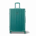 Front view of the GYL Intemporelle water green hard-shell suitcase, embossed logo and 360-degree wheels. #couleur_vert