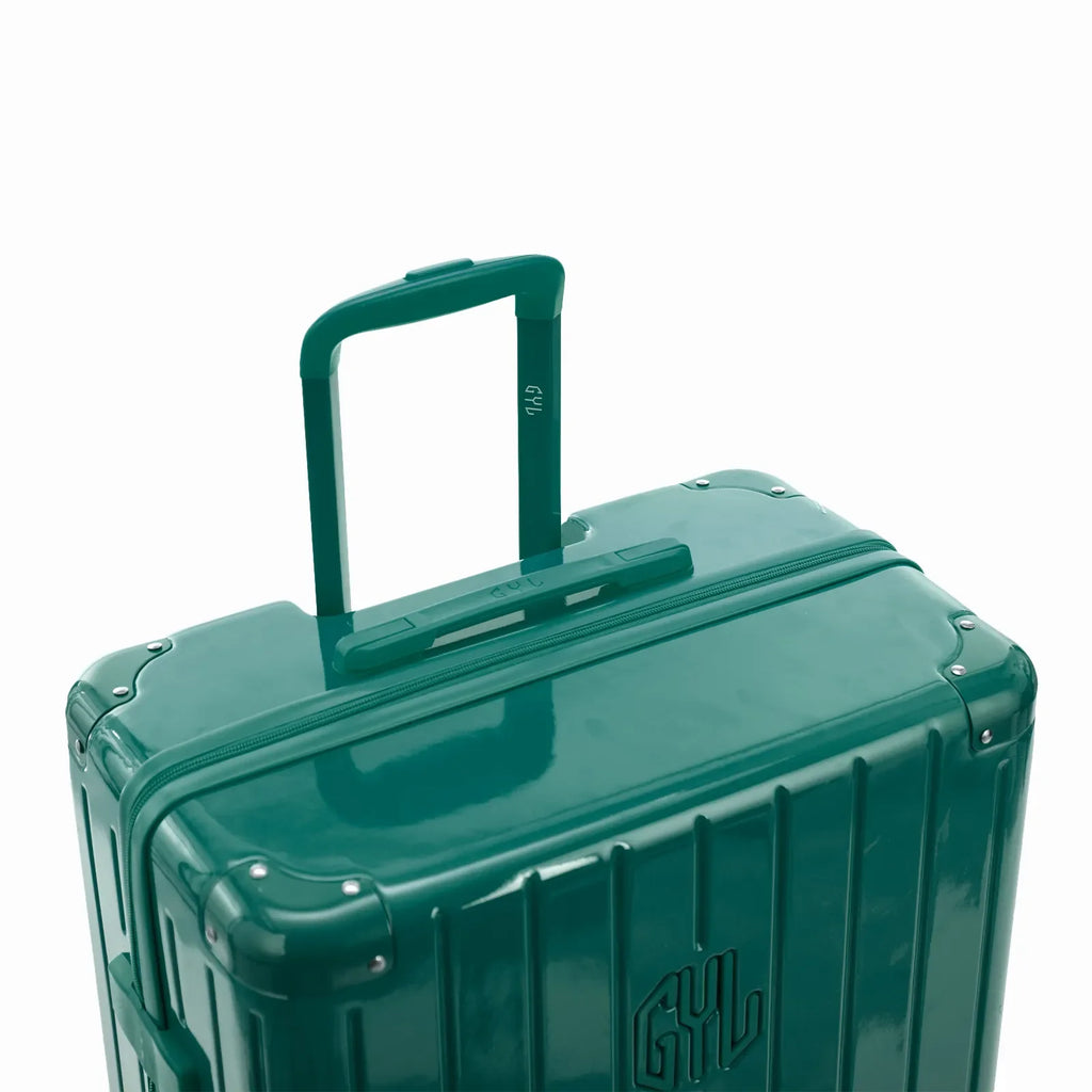 GYL telescopic trolley handle extended on the Intemporelle water green polycarbonate suitcase. #couleur_vert