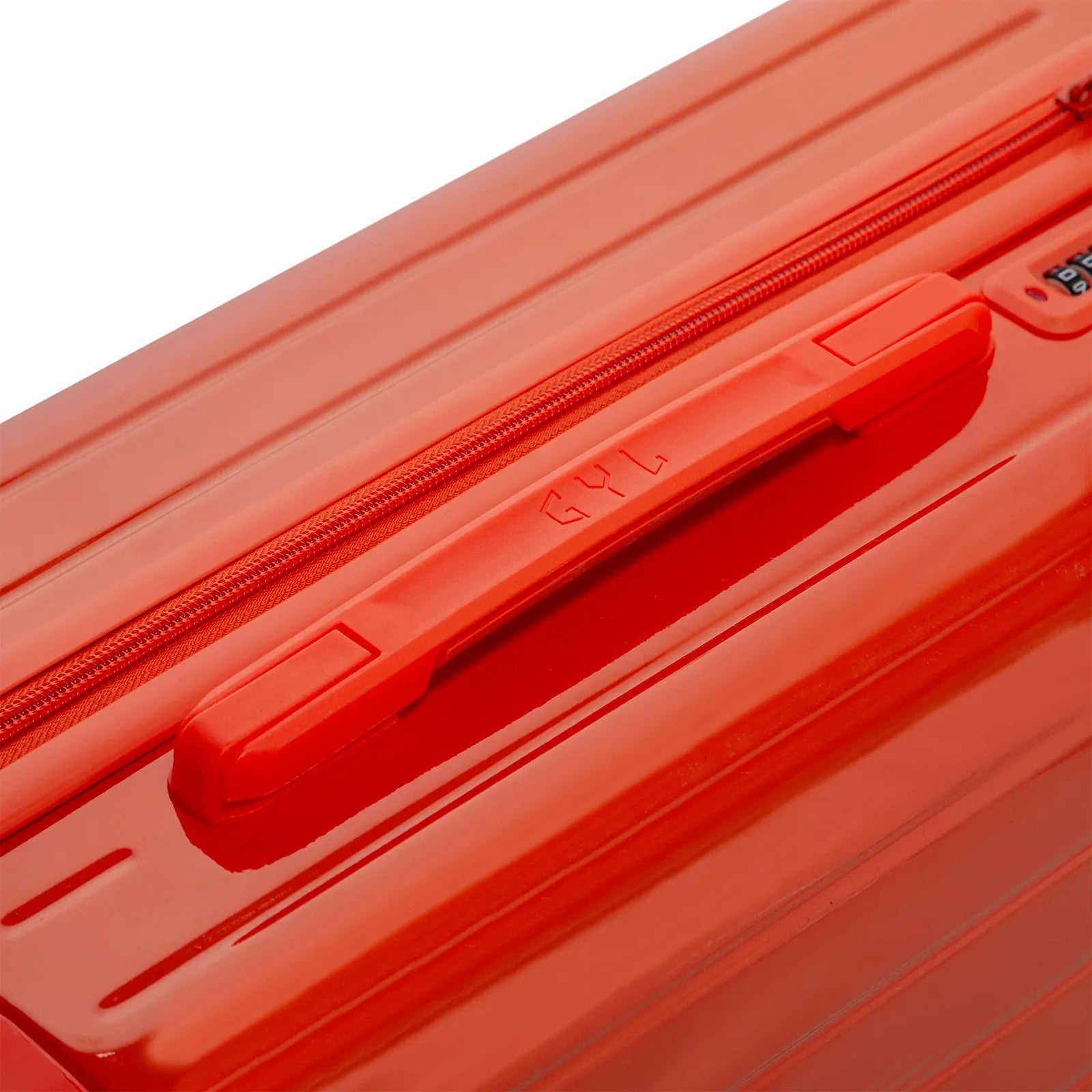 Asa superior rígida de la maleta GYL Intemporelle naranja con logo en relieve en la parte superior. #couleur_orange foncé