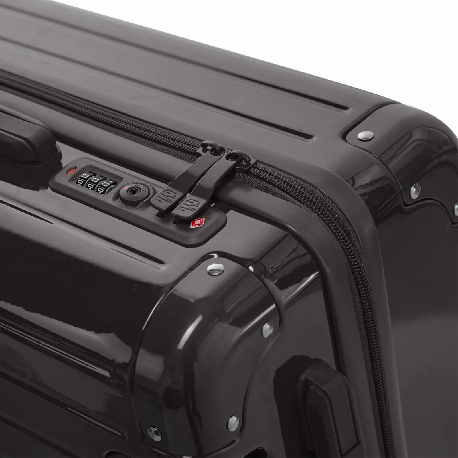 TSA combination lock and GYL double zip slider on the Intemporelle black hard-shell suitcase. #couleur_noir