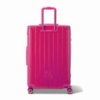 Rear view of the GYL Intemporelle fuchsia hard-shell suitcase with integrated handles and spinner wheels. #couleur_fuchsia