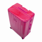 Angled view of the GYL Intemporelle fuchsia hard-shell suitcase with reinforced corners and glossy ribbed shell. #couleur_fuchsia