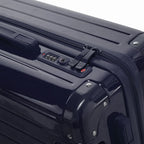 TSA combination lock and double GYL zip slider on the Intemporelle navy hard-shell suitcase. #couleur_marine