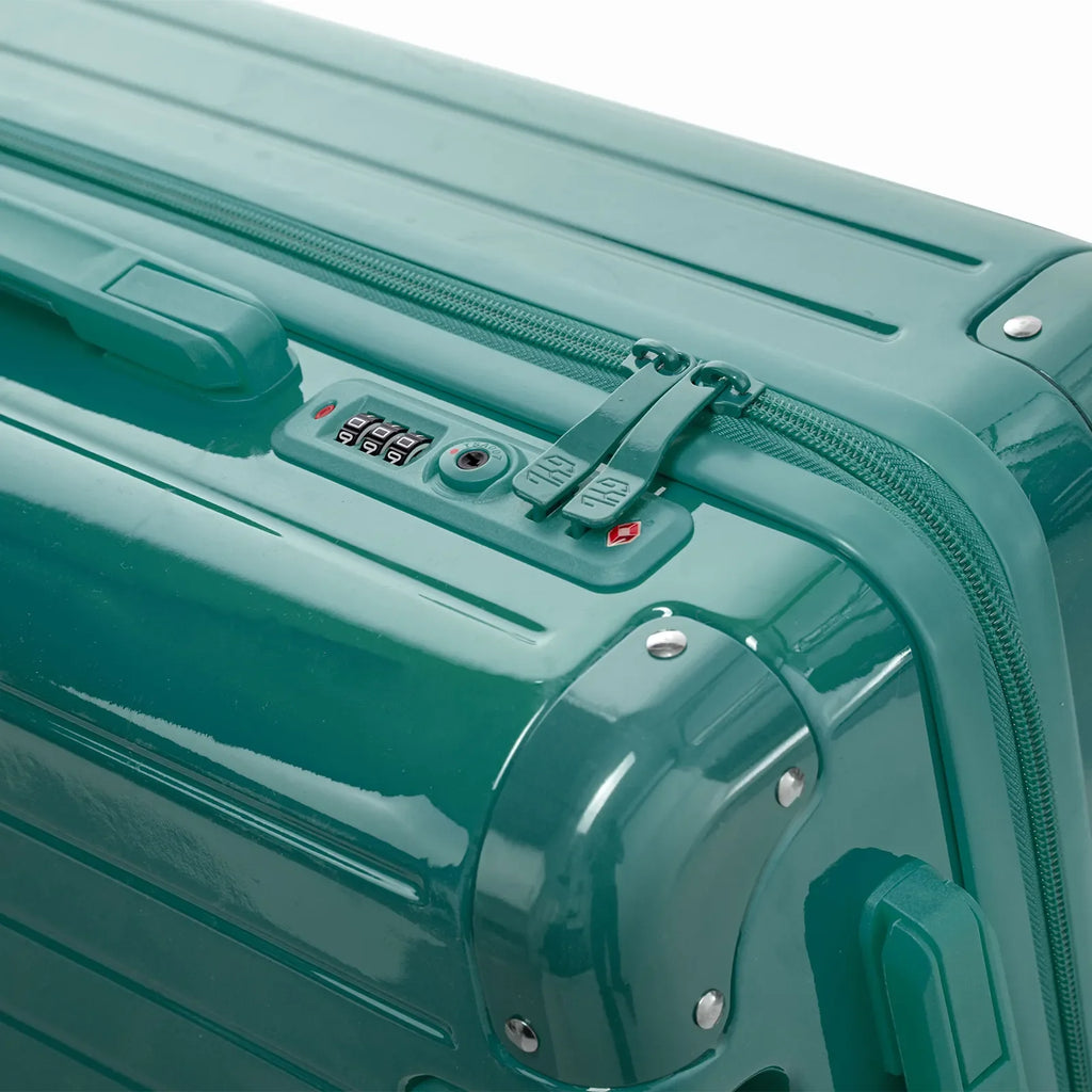 TSA combination lock and GYL double zip slider on the Intemporelle water green hard-shell suitcase. #couleur_vert